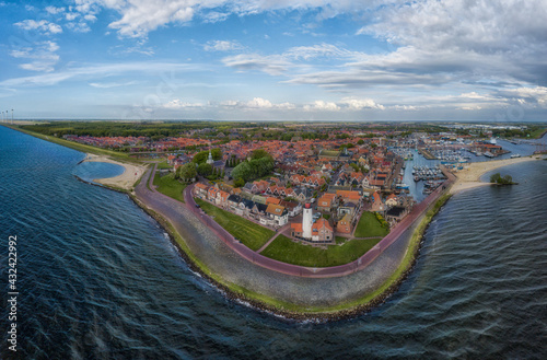 Panorama-aerial view of Urk with its lighthouse, a small coastal village on the IJsselmeer in the Netherlands.. photo