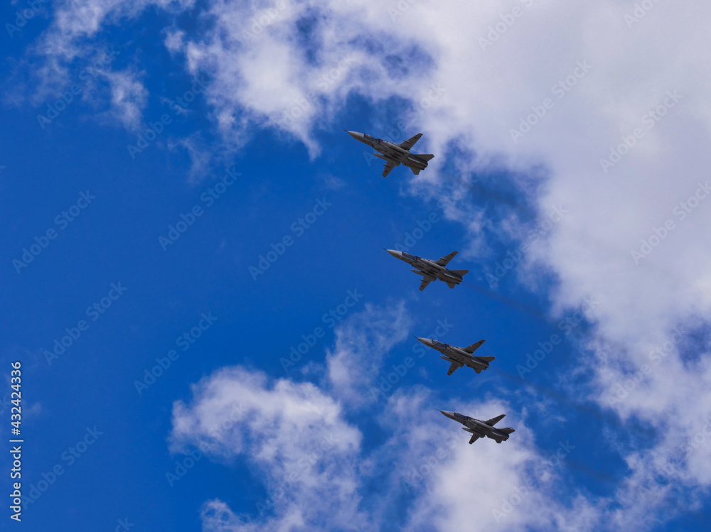 Fighter jets fly at ultra-low altitude over the city Fighter jets fly at ultra-low altitude over the city