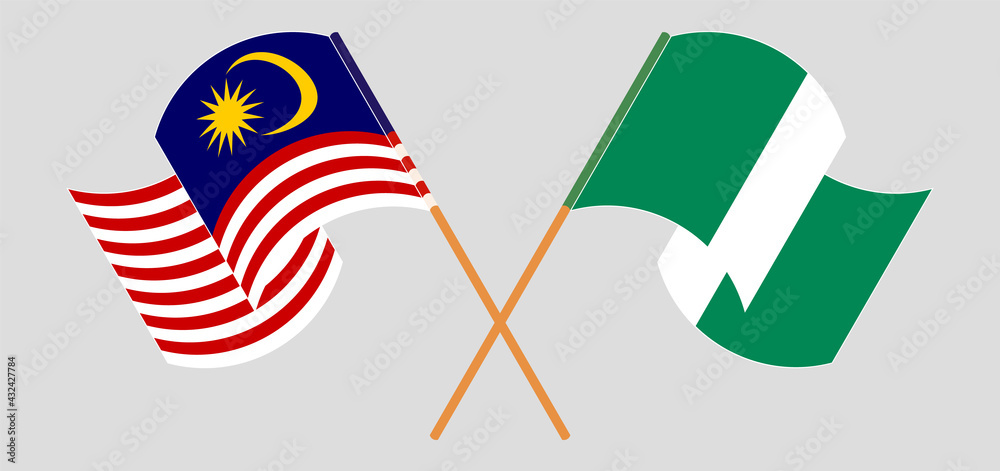 Crossed and waving flags of Malaysia and Nigeria Crossed and waving flags of Malaysia and Nigeria