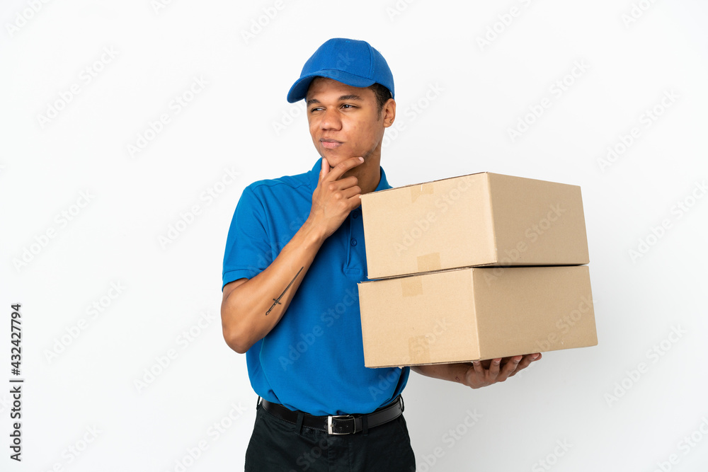 Delivery African American man isolated on white background and looking up Delivery African American man isolated on white background and looking up