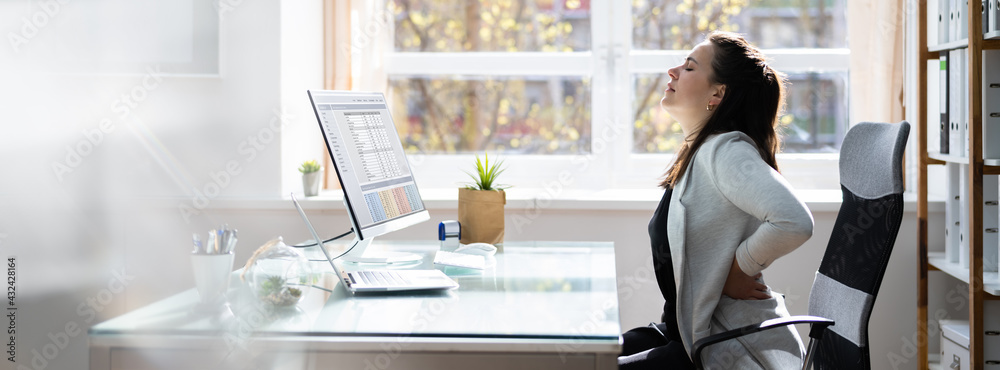 Fototapeta premium Bad Posture Sitting In Office With Backache
