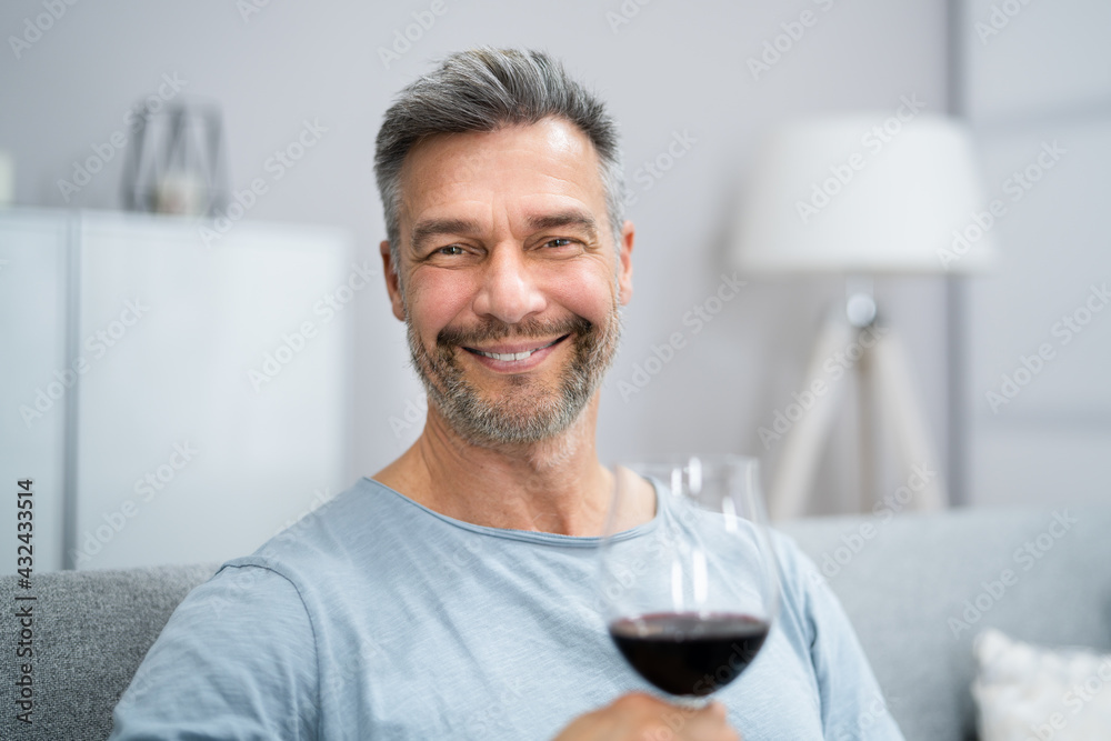 Man Drinking Red Wine In Video Conference Man Drinking Red Wine In Video Conference