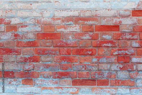 Texture of an old brick wall with natural defects. Scratches  cracks  crevices  chips  dust  roughness  grungy. Can be used as background for design or poster.