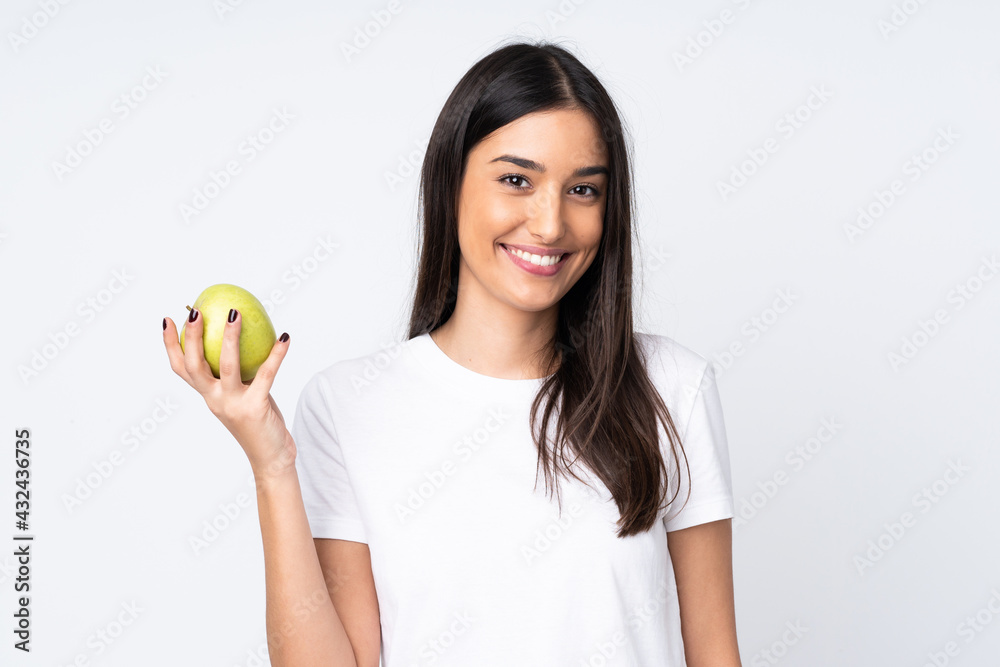 Young caucasian woman isolated on white background with an apple Young caucasian woman isolated on white background with an apple