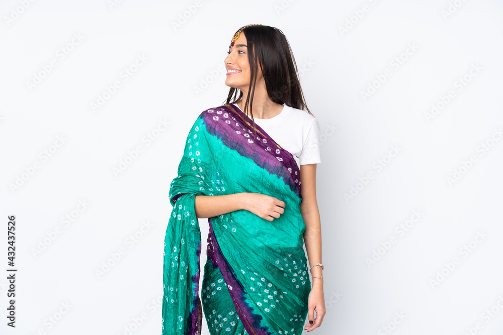 Young Indian woman isolated on white background looking side Young Indian woman isolated on white background looking side