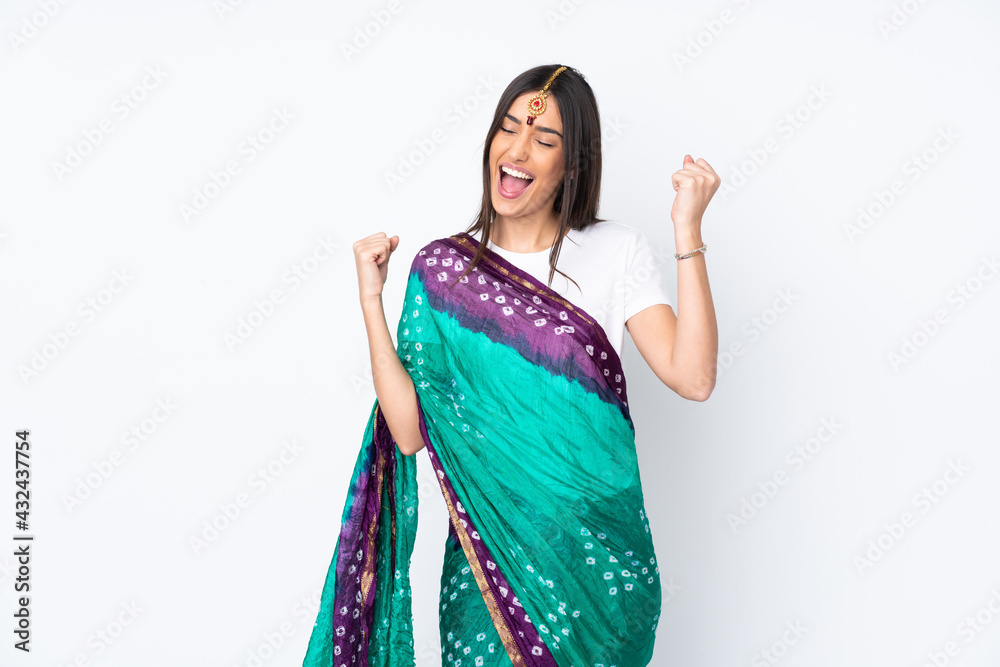 Young Indian woman isolated on white background celebrating a victory Young Indian woman isolated on white background celebrating a victory