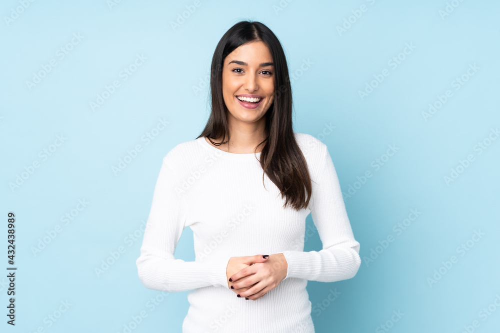Young caucasian woman isolated on blue background laughing Young caucasian woman isolated on blue background laughing