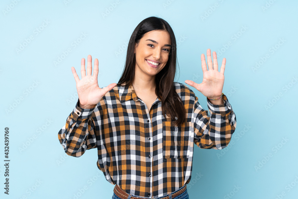 Young caucasian woman isolated on blue background counting ten with fingers Young caucasian woman isolated on blue background counting ten with fingers