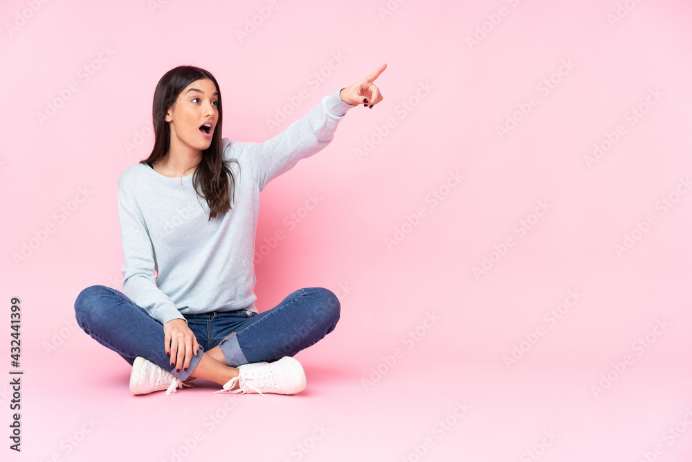 Young caucasian woman isolated on pink background pointing away Young caucasian woman isolated on pink background pointing away