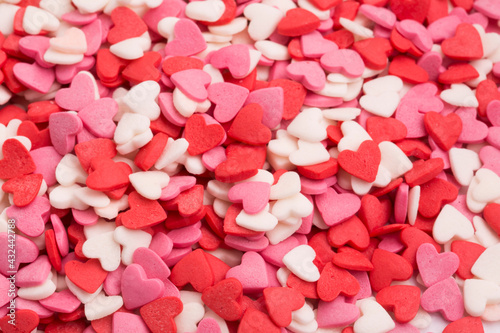 a heart shaped confetti on wite
