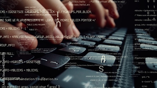 Creative visual of computer programming coding and software development shown by man working on computer keyboard with overlay of computer graphic displaying abstract program codes and computer script photo