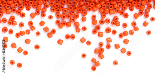 Close up of Orange Beads on the white background. Background or texture of beads. macro,It is used in finishing fashion clothes. make bead necklace or string of beads for woman of fashion.