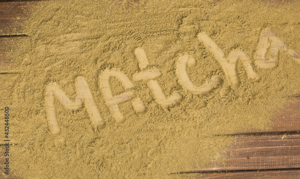 Fototapeta premium powder with words matcha tea on tea background