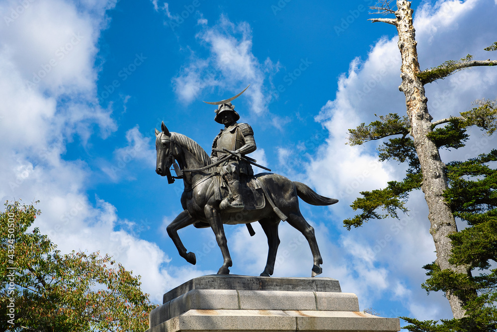 Date Masamune Monument at Aoba Castle, Sendai City, Miyagi Prefecture, Japan, in the daytime the background is blue sky and clouds.
