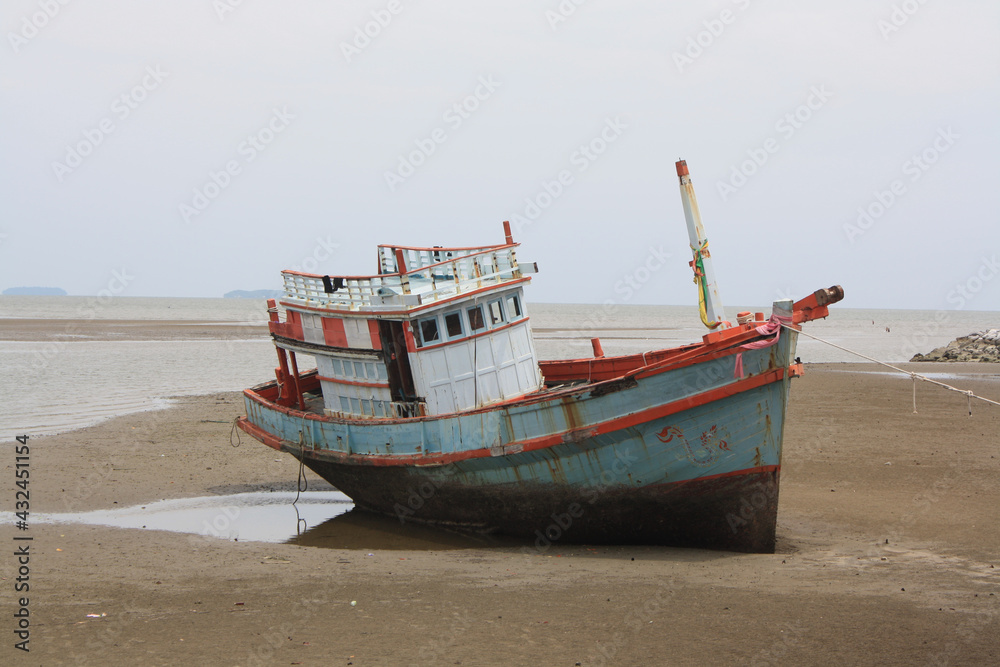 The old boat on the beach.