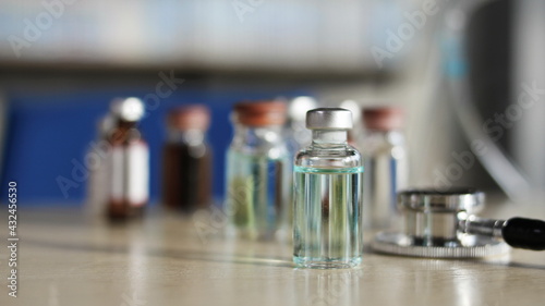 Vaccine bottle placed on table, Anti-virus vaccine bottle, copy space.