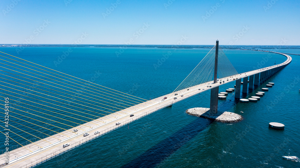 Sunshine Skyway Bridge in Tampa Bay Florida. Large Suspension Bridge that ships pass underneath. Florida gulf coast fishing pier.