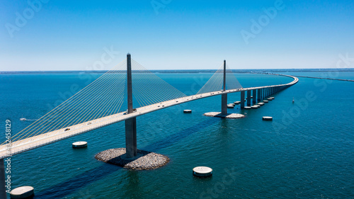 Sunshine Skyway Bridge in Tampa Bay Florida. Large Suspension Bridge that ships pass underneath. Florida gulf coast fishing pier.