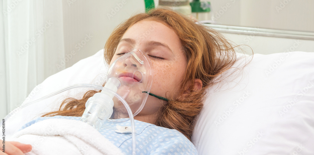 Cute little asian girl with oxygen pipe and using oxygen mask for ...