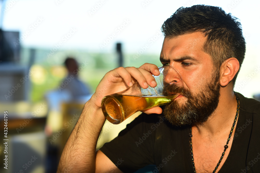 Hipster with beard and mustache in suit drinks beer after working day. Craft beer. Confident man with glass of beer. Beer pub and bar. Hipster with beard and mustache in suit drinks beer after working day. Craft beer. Confident man with glass of beer. Beer pub and bar.