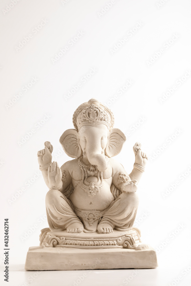 Statue of Lord Ganesha Made from plaster of Paris without color on white background.