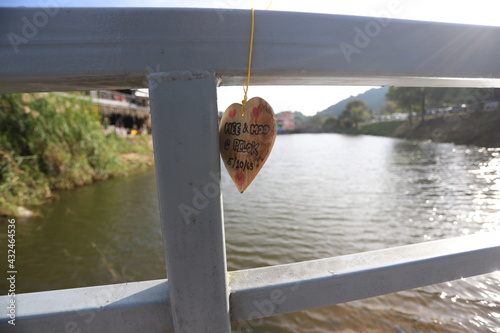 A wooden sign with a love message