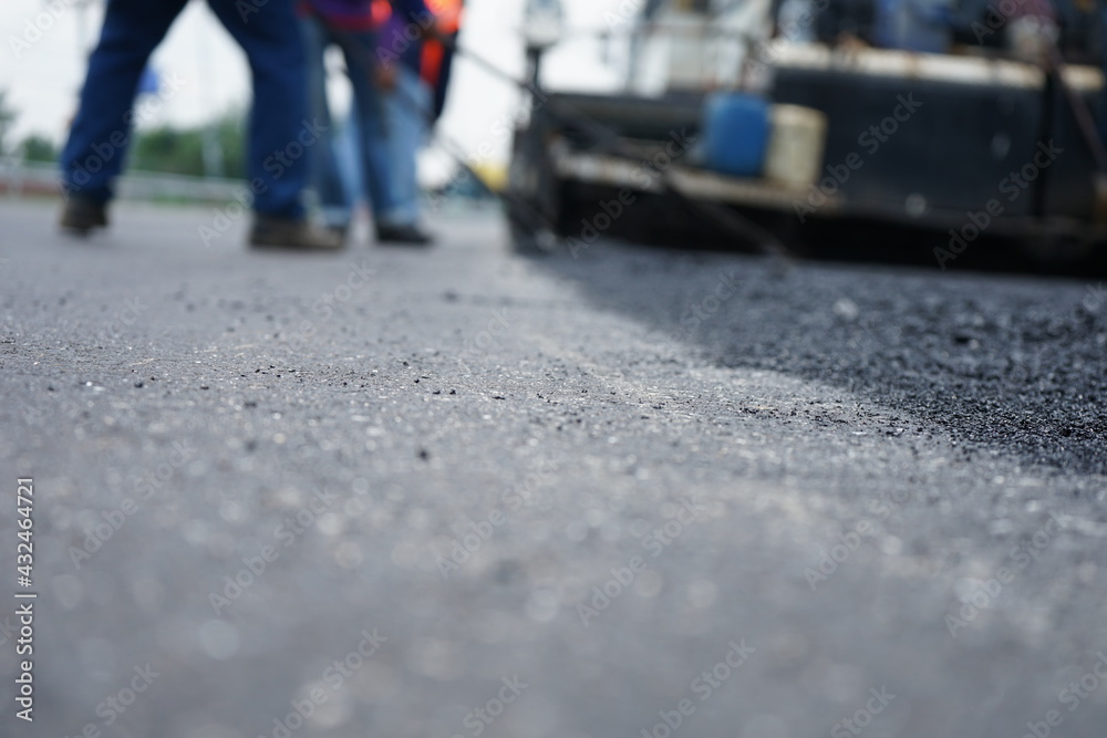 The image is blurred in the construction of asphalt road.