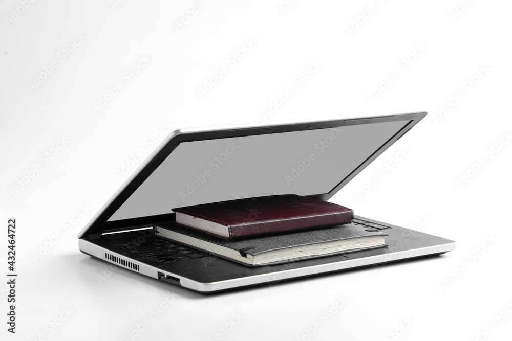 Modern workspace with laptop keyboard, notebook, spectacles on white background. Modern workspace with laptop keyboard, notebook, spectacles on white background.
