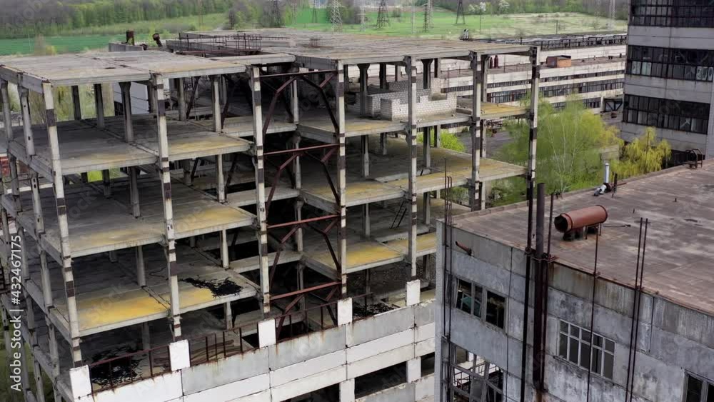 Aerial view of ruined abandoned building. Empty apocalipse city with damaged houses.