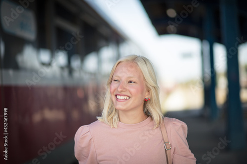 Young woman on train station.