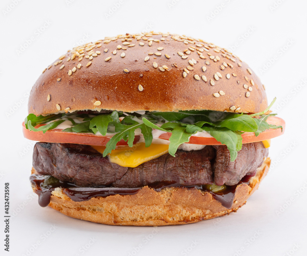 Delicious burger with juicy beef steak, melted cheese and arugula with tomato, on a white background. Template for the designer. Delicious burger with juicy beef steak, melted cheese and arugula with tomato, on a white background. Template for the designer.