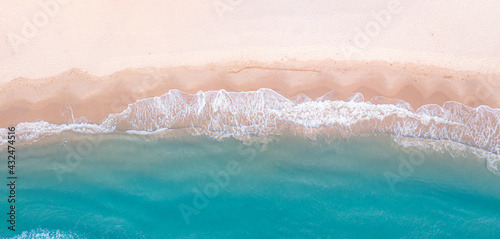 Panorama top view of blue aqua sea and white sand. Capture sea wave and beach in summer by drone. 