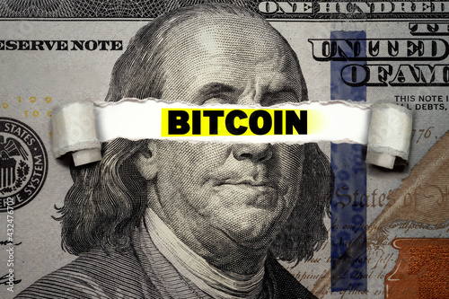 Torn bills revealing BITCOIN words. Ideas for blockchain technology and traditional currency, Stable Currency, digital currency, U.S. Dollar coin, centralized stable coin, Defi, and alternative dollar photo