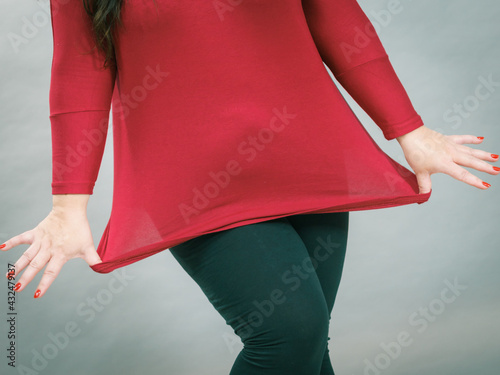 Obraz na plátně Woman plus size in red tunic