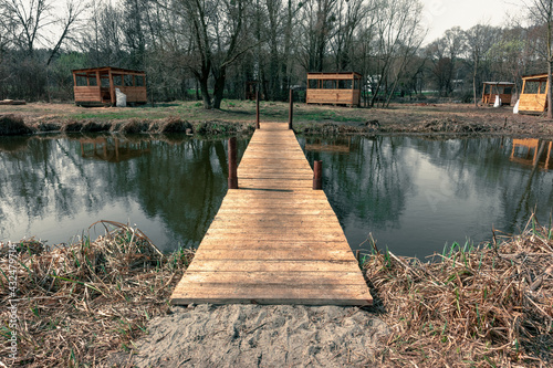 A small wooden bridge over a narrow river