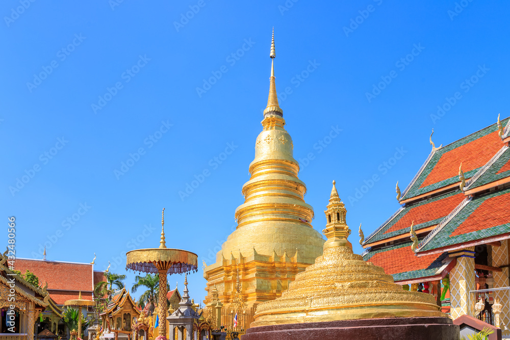 Fototapeta premium Golden pagoda at Wat Phra That Haripunchai Woramahawihan in Lamphun, north of Thailand