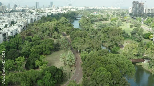 Wallpaper Mural Aerial Shot Of Beautiful Yarkon Park With Trees And River In City, Drone Flying Over Trees - Tel Aviv, Israel Torontodigital.ca
