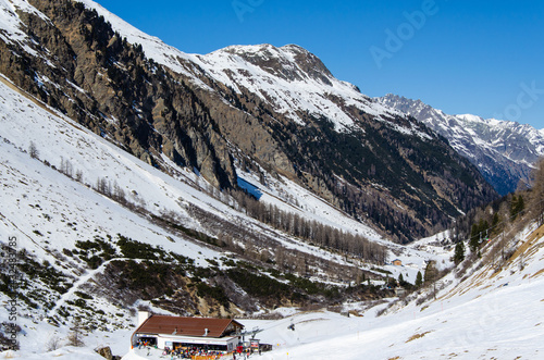small huts on snow-covered alpine slopes near the Austrian ski resort of Ischgl