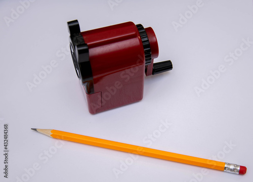 Sharpening a simple pencil with a sharpener.