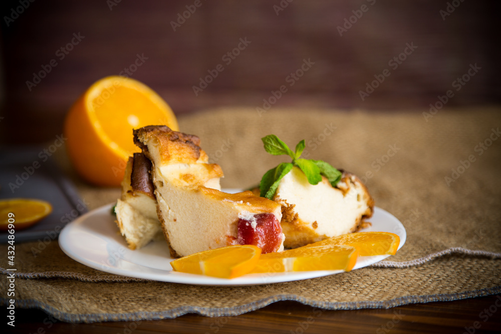 Sweet curd casserole with fruits in a plate Sweet curd casserole with fruits in a plate