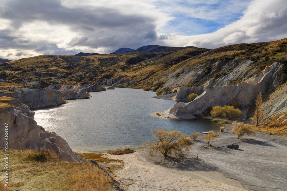 The Blue Lake at St. Bathans, a small town in the South Island of New Zealand. Created by gold mining operations, it is now a scenic attraction. Photographed in autumn
