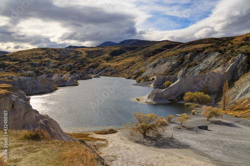 The Blue Lake at St. Bathans  a small town in the South Island of New Zealand. Created by gold mining operations  it is now a scenic attraction. Photographed in autumn