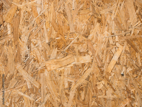 Oriented strand board-looks like a compressed scattering of chips and large shavings.