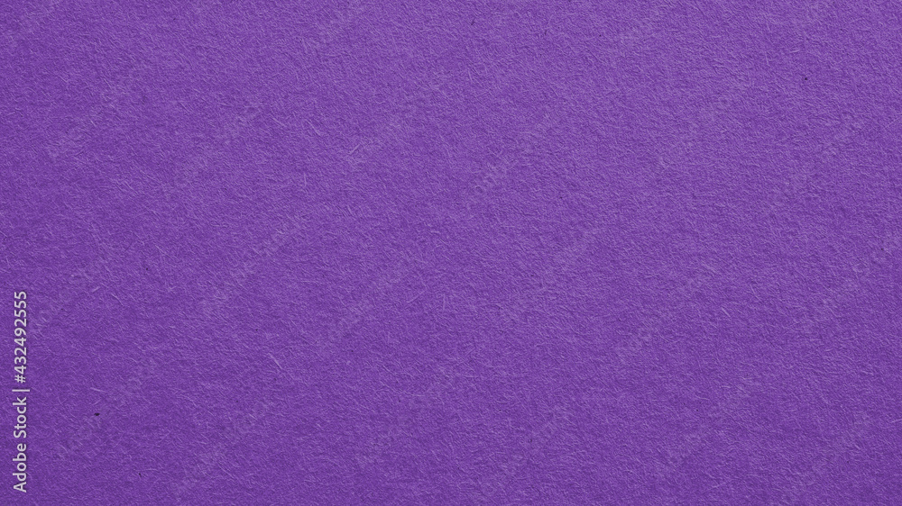 The surface of violet cardboard. Paper texture with cellulose fibers. Dark summer paperboard wallpaper. Bright purple tinted background. Saturated color. Top-down. Macro The surface of violet cardboard. Paper texture with cellulose fibers. Dark summer paperboard wallpaper. Bright purple tinted background. Saturated color. Top-down. Macro