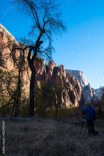Artist drawing the picture in the Zion. Airpainting with a beautiful view photo