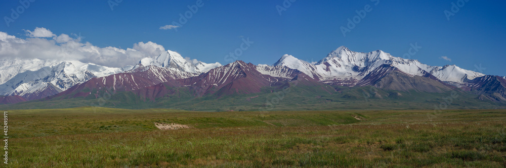 Panoramic view of snow-capped Trans-Alai mountain range on the Pamir highway between Sary Tash and Kyzyl Art pass, southern Kyrgyzstan