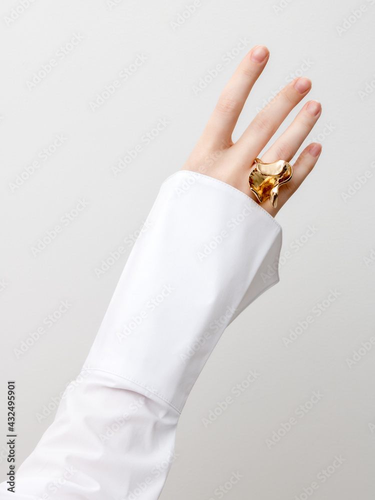 Beautiful Woman Hands . closeup hands of young woman with natural manicure polished nails wearing an expensive engagement ring . Minimalism Beautiful Woman Hands . closeup hands of young woman with natural manicure polished nails wearing an expensive engagement ring . Minimalism