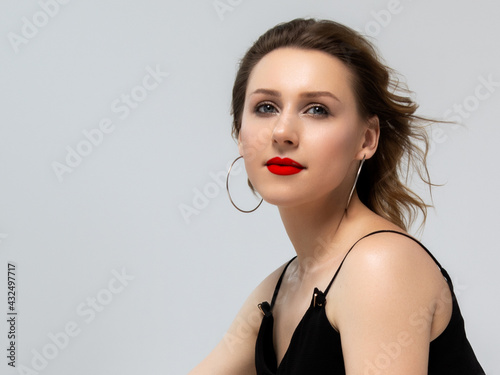 Makeup, cosmetics. Beauty young woman portrait. Beautiful model girl with beauty makeup , red lips , perfect fresh skin . Attractive lady with green eyes. Youth and Skin Care Concept