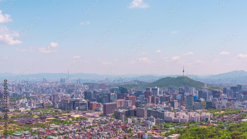 Time lapse 4K Seoul city skyline and Seoul tower modern building and architecture, Beautiful clouds flow through in Seoul, South Korea.Zoom in Time lapse 4K Seoul city skyline and Seoul tower modern building and architecture, Beautiful clouds flow through in Seoul, South Korea.Zoom in