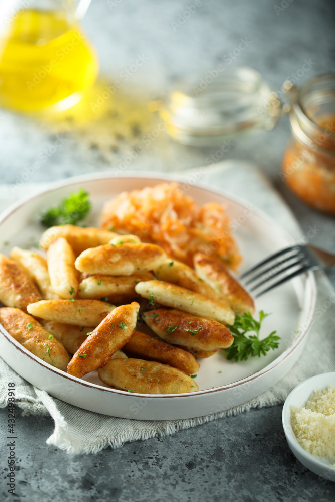 Traditional German potato dumplings served with parsley Traditional German potato dumplings served with parsley